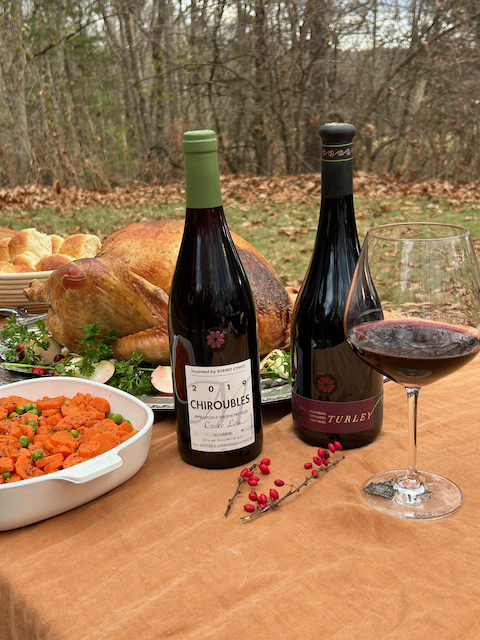 Turley and Guy Breton Wines on a thanksgiving table outdoors.